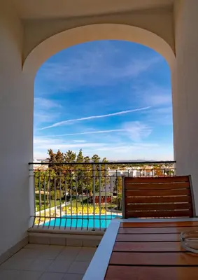 a balcony with a view of a pool at Vila Petra in Albufeira