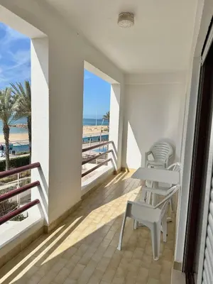 an aerial view of a beach and the ocean at Apartamentos Carteia in Quarteira