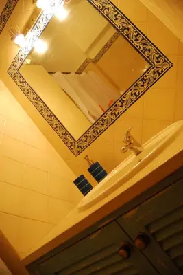a bottle of soap sitting on top of a bathroom sink at Nautic in Quarteira