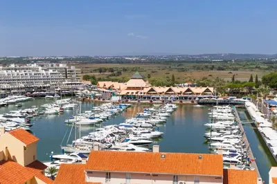 a harbor filled with lots of boats in the water at The Navigator - Olympus Marina in Vilamoura