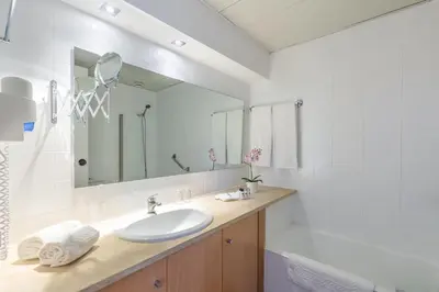 a bathroom with a sink and a mirror at The Navigator - Olympus Marina in Vilamoura