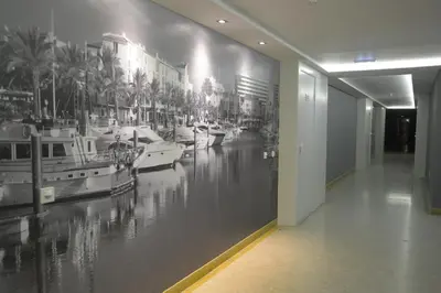 a hallway with a wall mural of a marina at The Navigator - Olympus Marina in Vilamoura