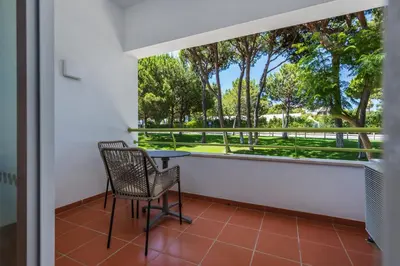 a living room with a couch and a table at The Patio Suite Hotel in Albufeira