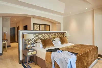 a bedroom with a large bed in a room at Dona Filipa Hotel in Vale do Lobo