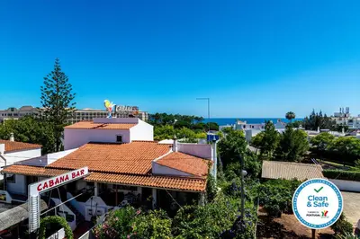 a building with a sign on top of it at WHome | Albufeira Suite & Beach Apartment in Albufeira