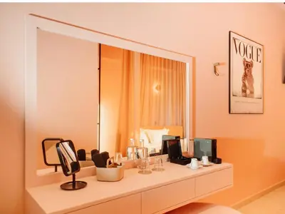 a room with two chairs and a lamp and a window at Topazio Vibe Beach Hotel & Apartments - Adults Friendly in Albufeira