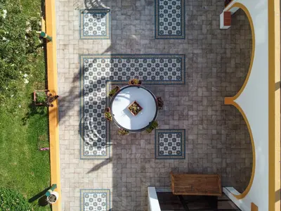 an overhead view of a patio with a table and a bench at Alfagar Cerro Malpique in Albufeira