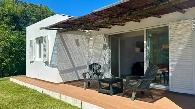 a patio with two chairs and a table on a deck at Galo by Check-in Portugal in Albufeira