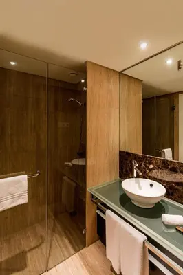 a bathroom with a sink and a shower at As Cascatas Golf Resort & Spa in Vilamoura