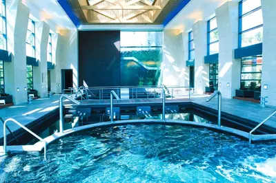 a large pool of water in a building at As Cascatas Golf Resort & Spa in Vilamoura