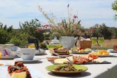 a table with food and drinks on it at Quinta Do Mel in Albufeira