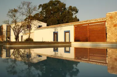 a house with a pool in front of it at Quinta Do Mel in Albufeira