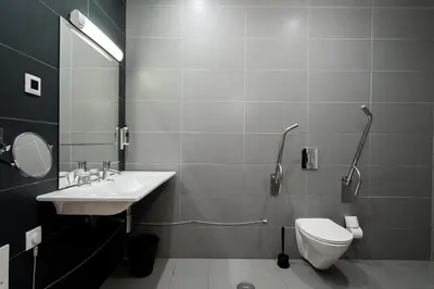 a bathroom with a sink and a toilet at KR Hotels - Albufeira Lounge in Albufeira