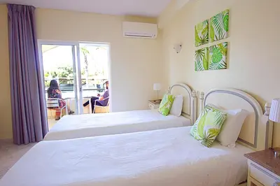 a hotel room with two beds and a balcony at WOT Algarve Soul in Almancil