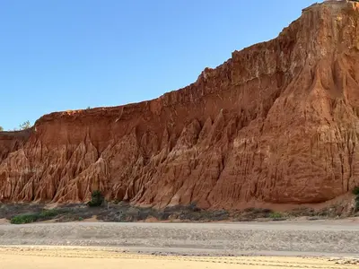 a brown mountain with a dirt road in front of it at Apartamentos Do Parque in Albufeira