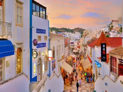 a view of a city street at sunset at V3, Villa Belo Horizonte near Beach, Albufeira in Albufeira