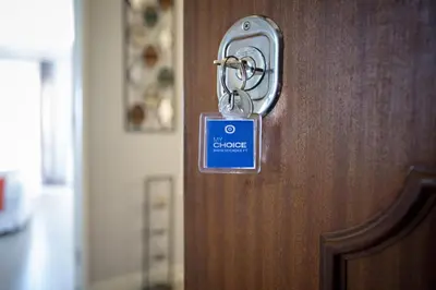 a lock on a door with a sign on it at Apartamento Gulbenkian in Faro