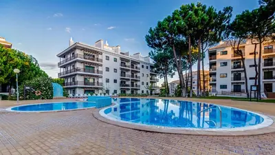 a large swimming pool in front of a building at Apartamento Falésia by Garvetur in Albufeira