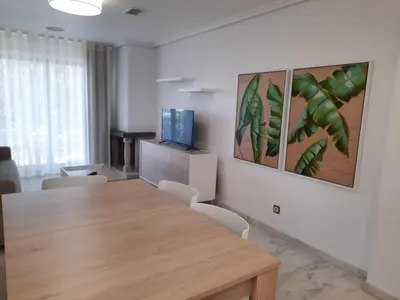 a conference room with a wooden table and chairs at Apartamento Falésia by Garvetur in Albufeira