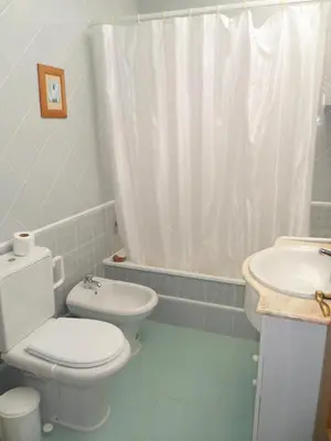 a bathroom with a toilet and a sink at Casa na praia e golfe in Vale do Lobo