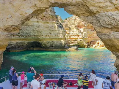 a group of people on a boat in a cave at Luxury Holiday Villa Alegria Galé Beach, Albufeira in Albufeira
