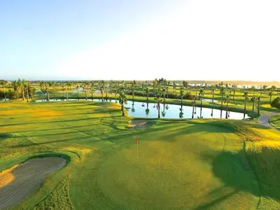 an aerial view of a golf course with a pond at Luxury Holiday Villa Alegria Galé Beach, Albufeira in Albufeira