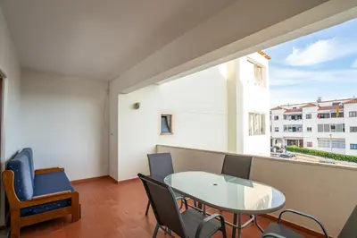 a small buddha statue sitting in a bowl of water at Apartamento Stª Eulália Deluxe by Umbral in Albufeira