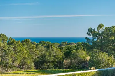 a view of the ocean from the road at Villa Costa by Gabi Miguel in Albufeira