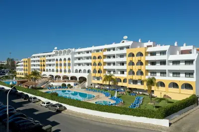 a lobby with a counter in a building at Aparthotel Paladim & Alagoamar in Albufeira