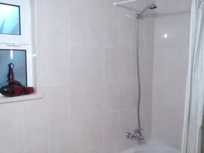 a bathroom with a shower with a glass door at Charming Apartment in Albufeira, 60 m², Mountain View in Albufeira