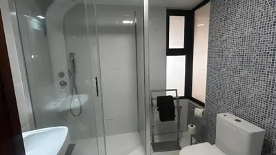 a bathroom with a shower and a toilet and a sink at Albufeira Ocean Terrace (31) in Albufeira