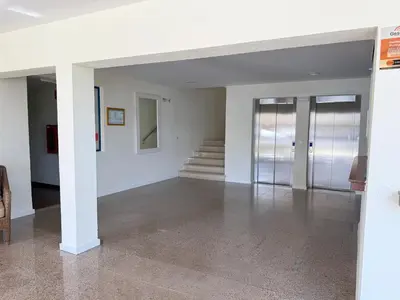 an empty room with white walls and a staircase at Rio by Garvetur in Vilamoura