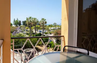 a kitchen with a sink and a microwave at Marina Plaza by Garvetur in Vilamoura