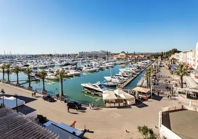 a marina filled with lots of boats in the water at Marina Plaza by Garvetur in Vilamoura