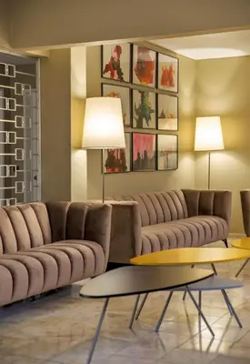 a living room with a couch and a table at Turial Old Town Ocean View in Albufeira