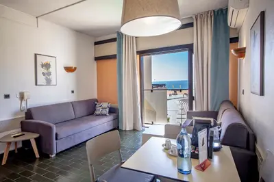 a living room with a couch and a table at Turial Old Town Ocean View in Albufeira