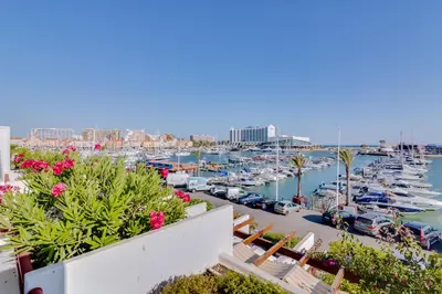 a view of a marina with boats in the water at São Vicente - 1Br - Facing to Marina in Quarteira