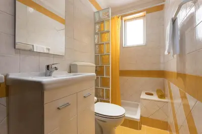 a bedroom with a large bed and a window at Villa Morena in Albufeira