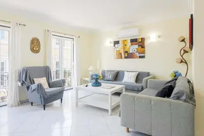 a living room with two couches and a table at Old Village & Prestige in Vilamoura