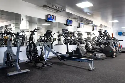 a gym with a bunch of exercise bikes in a room at Browns Sports Resort in Vilamoura