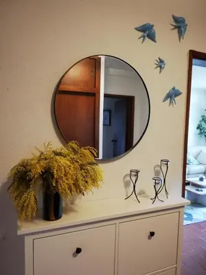 a mirror on top of a dresser in a room at Sea View urban apartment in Faro