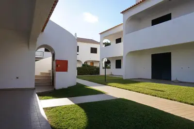 an external view of a house with a lawn at Modern Pool Apartment, Vilamoura in Quarteira
