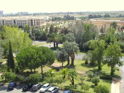 an aerial view of a parking lot with trees and buildings at Parque das Amendoeiras in Vilamoura