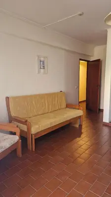 a living room with a couch in a room at Parque das Amendoeiras in Vilamoura