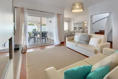 a living room with a couch and a table at Villa Francella- Relaxing holidays in an ideal location by DreamvillasAlbufeira in Albufeira