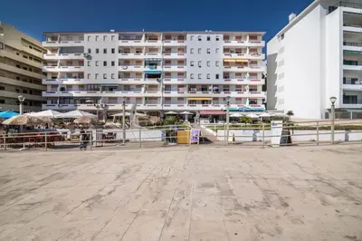 a view of a large apartment building with buildings at Charming Apartment in Quarteira - 50 m² - Terrace in Quarteira