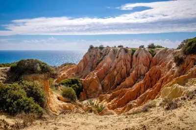 a view of a rocky mountain near the ocean at Spacious apartment in Albufeira 80 m² with shared pool in Roja- Pé
