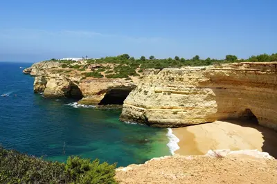 a view of a rocky shoreline with the ocean at Charming Apartment in Albufeira - 60 m² with pool & view in Albufeira