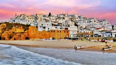 a painting of a beach with white buildings at magnifique maison en resort près des plages in Albufeira