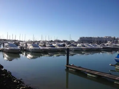 a bunch of boats parked in a marina at Casa da Bia in Quarteira